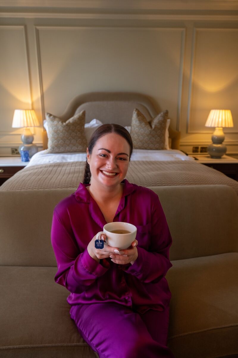 Irish Examiner reporter Breda Graham enjoys a cup of Pukka night-time tea while testing a range of sleep aids in the Shandon Suite at Hayfield Manor. Picture Chani Anderson