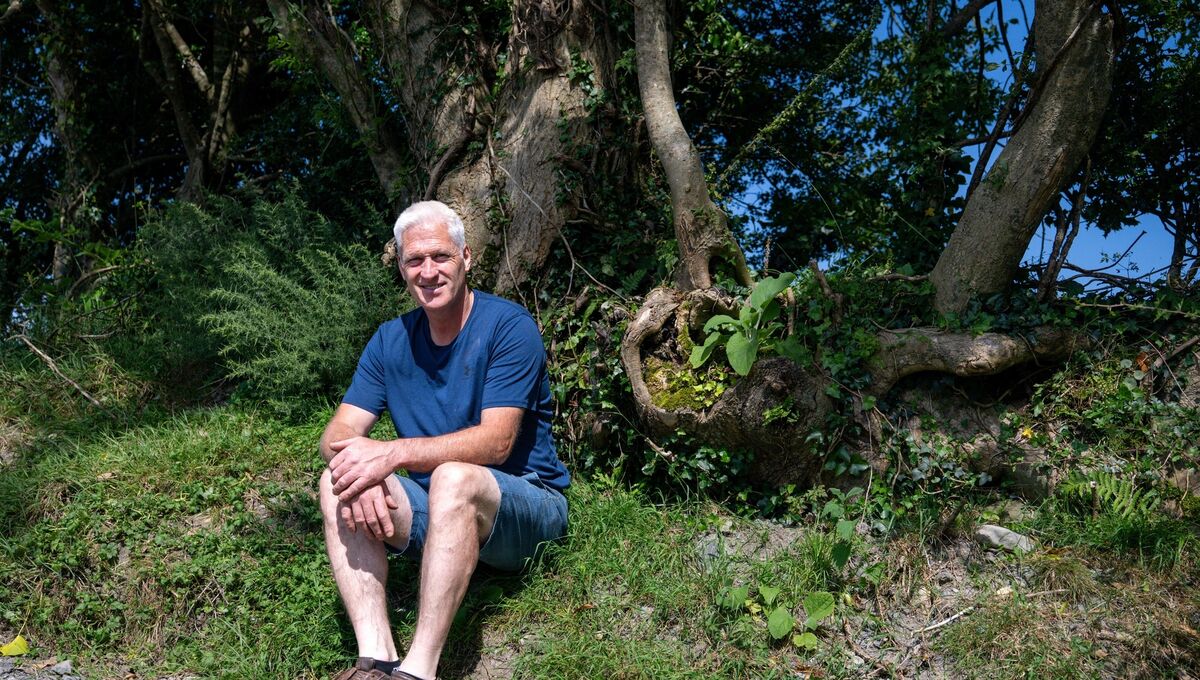 John Hurley on his farm, where he has introduced a range of biodiversity initiatives including native hedgerows, pollinator habitats and tree planting. Picture: Chani Anderson