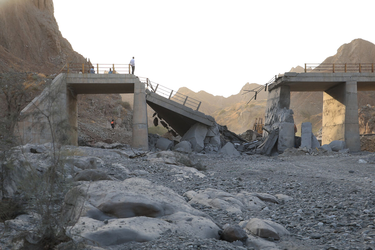 People stand on a bridge destroyed after a strike in Hormozgan province, southern Iran, Saturday, July 18, 2026. (Amirhosein Khorgooi/Iranian Students' News Agency via AP) People stand on a bridge destroyed after a strike in Hormozgan province, southern Iran, Saturday, July 18, 2026. (Amirhosein Khorgooi/Iranian Students' News Agency via AP)