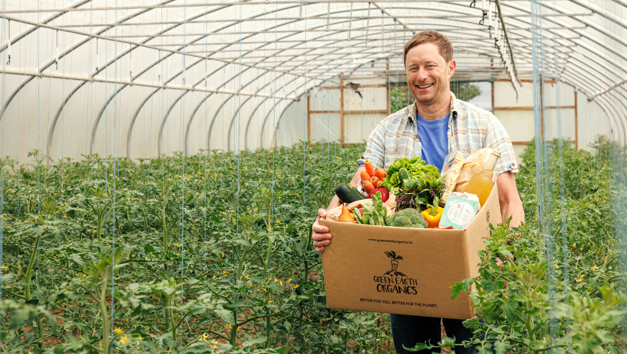 Founder Kenneth Keavy pictured holding Green Earth Organics summer essentials grocery box. Picture: Kirsty Lyons