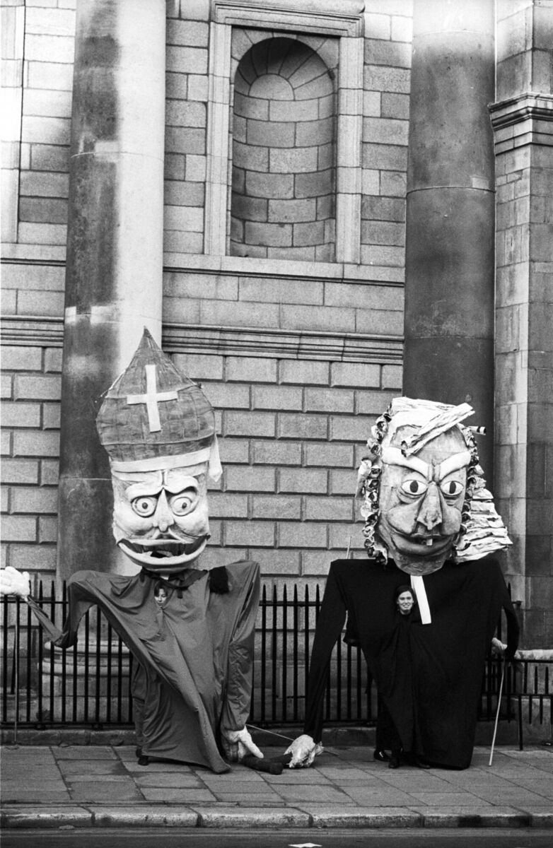 Puppets of a bishop and a judge, symbolising the twin sources of control on women's lives during a protest in 1987.