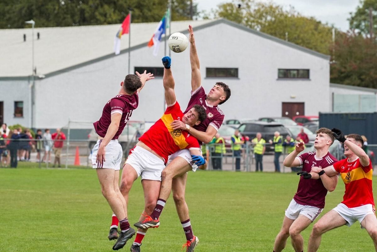 Éire Óg’s Colm O'Callaghan held back by Bishopstown’s Michael Power. Picture: Noel