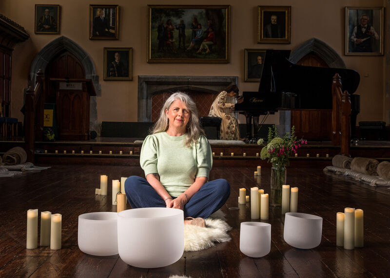 Journalist Deirdre McArdle meditates while composer Christina McMaster plays piano at the Lie Down &amp; Listen workshop by which took place at the Aula Maxima in University College Cork. - Picture: David Creedon