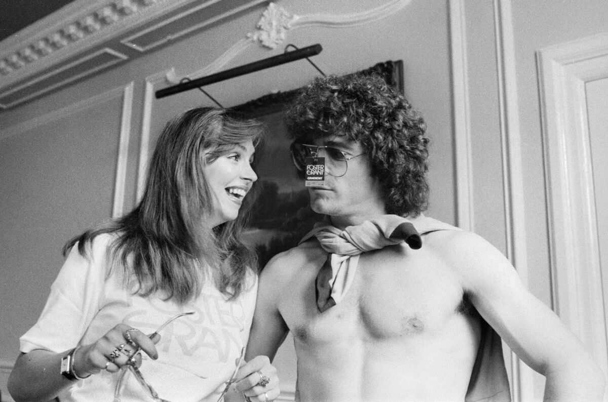 June 5, 1980: Kevin Keegan with model Lucinda Jane as he tries on a pair of Foster Grant sunglasses at FA Cockfosters HQ in London. Picture: Bunny Atkins/Daily Mirror/Mirrorpix/Getty June 5, 1980: Kevin Keegan with model Lucinda Jane as he tries on a pair of Foster Grant sunglasses at FA Cockfosters HQ in London. Picture: Bunny Atkins/Daily Mirror/Mirrorpix/Getty