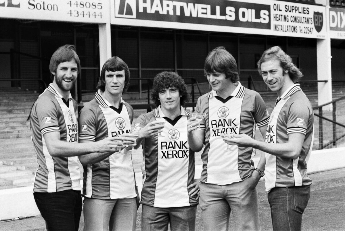 September 19, 1980: Southampton players Chris Nicholl, Dave Watson, Kevin Keegan, Mick Channon, and Charlie George raising a champagne toast to their new Rank Xerox shirts on the eve of a match against Liverpool. Picture: Bill Kennedy/Daily Mirror/Mirrorpix/Getty September 19, 1980: Southampton players Chris Nicholl, Dave Watson, Kevin Keegan, Mick Channon, and Charlie George raising a champagne toast to their new Rank Xerox shirts on the eve of a match against Liverpool. Picture: Bill Kennedy/Daily Mirror/Mirrorpix/Getty