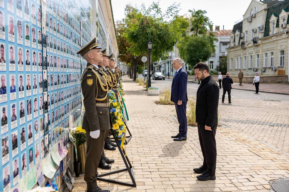 Taoiseach Micheál Martin and Ukrainian president Volodymyr Zelenskyy during a solemn moment at the wall of remembrance near St Michael’s Cathedral in Kyiv yesterday. The memorial honours those who have died while defending Ukraine from Russia’s attacks. 	Pictures: Government Information Service
                    