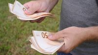 Counting Money Hands Holding Euro Bills, Examining the Value of Cash and Currency Assets