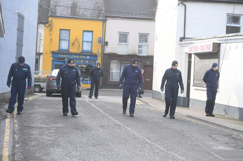 A Garda search team at Lucey's Lane, Macroom, Co Cork where the body of 61-year-old Michael Foley was discovered at his home. Picture: Larry Cummins A Garda search team at Lucey's Lane, Macroom, Co Cork where the body of 61-year-old Michael Foley was discovered at his home. Picture: Larry Cummins