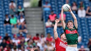 <p>SOARING: Mayo’s Kobe McDonald claims a high ball against Cork in the All-Ireland quarter final. 'I would say he loves basketball as much as he loves football,' says Liam MacHale. Pic: James Crombie, Inpho</p>