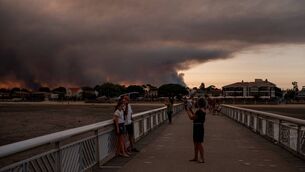 <p>People pose on the beach in Andernos-Les Bains during a fire in Lege Cap-Ferret forest, southwestern France, on July 23, 2026, as part of the nearby area has been evacuated. Picture: Olivier MORIN / AFP via Getty Images</p> <p>People pose on the beach in Andernos-Les Bains during a fire in Lege Cap-Ferret forest, southwestern France, on July 23, 2026, as part of the nearby area has been evacuated. Picture: Olivier MORIN / AFP via Getty Images</p>