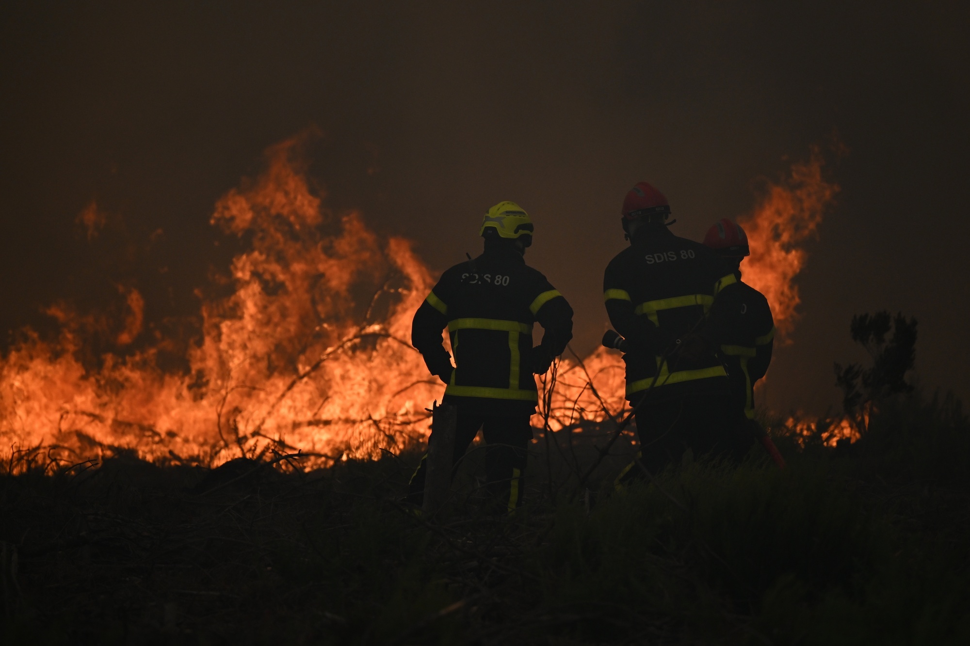 France and Spain battle wildfires as more than 250,000 people are forced to flee