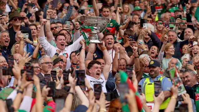 <p>Mayo's Jack Coyne lifts the Sam Maguire Cup. Pic: INPHO/Tom Maher</p>
