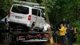 <p>The vehicle used to ram into a crowd at the Pride march is removed (Ebrahim Noroozi/AP)</p>