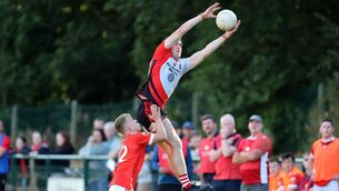 <p>HIGH AND MIGHTY: Dylan Hourihane, O'Donovan Rossa puts pressure on Rory Lynn of Newmarket at Macroom. Picture: Jim Coughlan.</p>