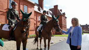 <p>Lt. Raphael Lee on Bon Mahon and Pte. Aoife Curran on Glen Darra greet Minister for Defence Helen McEntee, TD at McKee Barracks at a parade to mark the centenary of the Army Equitation School. Pictures: Colin Keegan.</p>