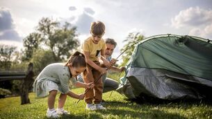 <p>a multigenerational family is camping in a park by the river and setting up a tent</p> <p>a multigenerational family is camping in a park by the river and setting up a tent</p>