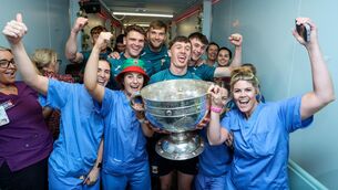 <p>Jordan Flynn, Aidan O'Shea, Jack Coyne and Eoin McGreal with with nurses from the CHI Temple Street. Pic: ©INPHO/Tom Maher.</p>