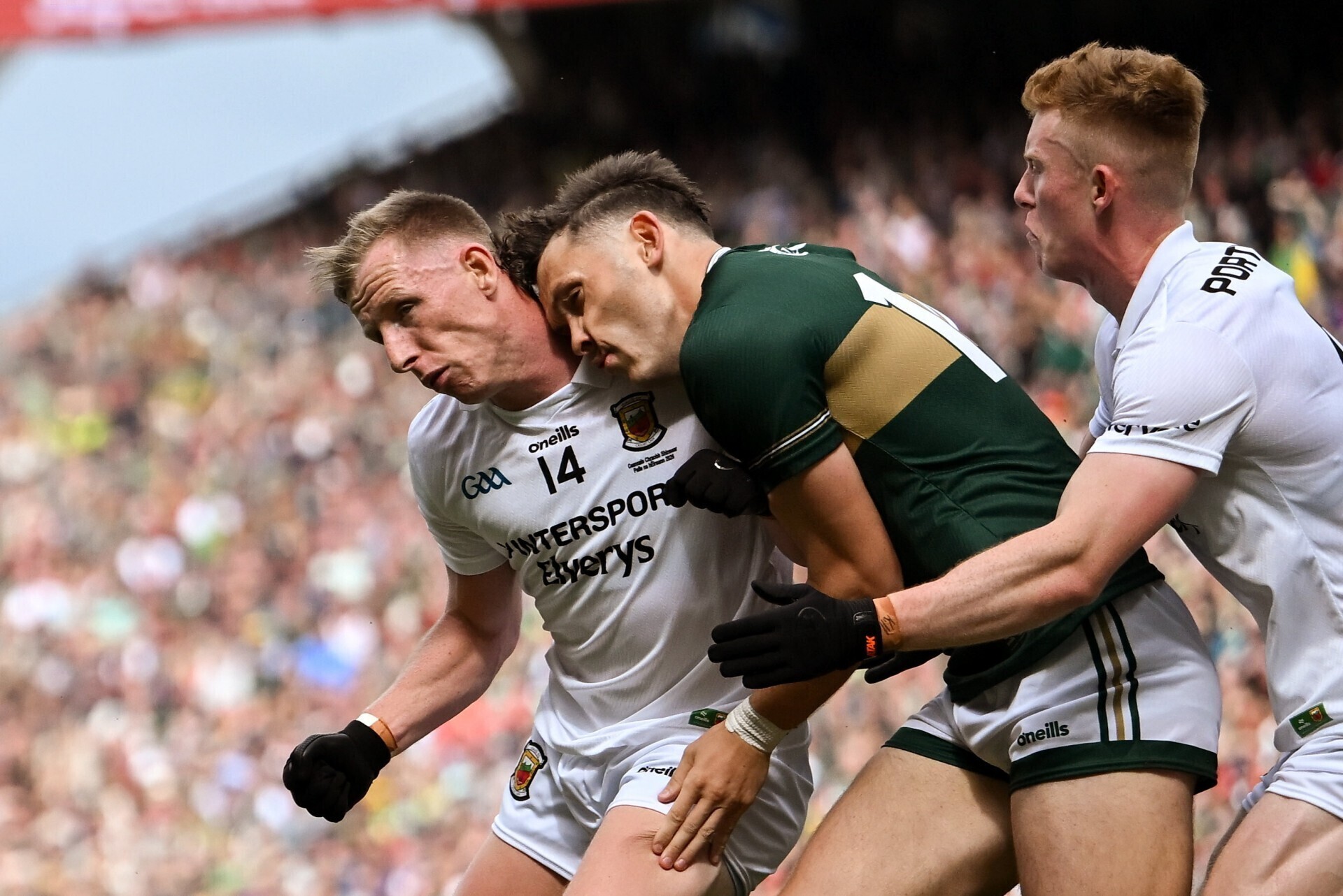 David Clifford of Kerry gets a shoulder from Ryan O'Donoghue of Mayo. Pic: Stephen McCarthy/Sportsfile