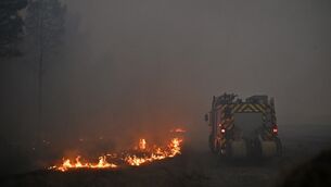 <p>A fire engine drives through smoke of a wildfire raging near Marcheprime, outside, Bordeaux, France, Sunday, July 26, 2026. (AP Photo/Emma Da Silva)</p> <p>A fire engine drives through smoke of a wildfire raging near Marcheprime, outside, Bordeaux, France, Sunday, July 26, 2026. (AP Photo/Emma Da Silva)</p>