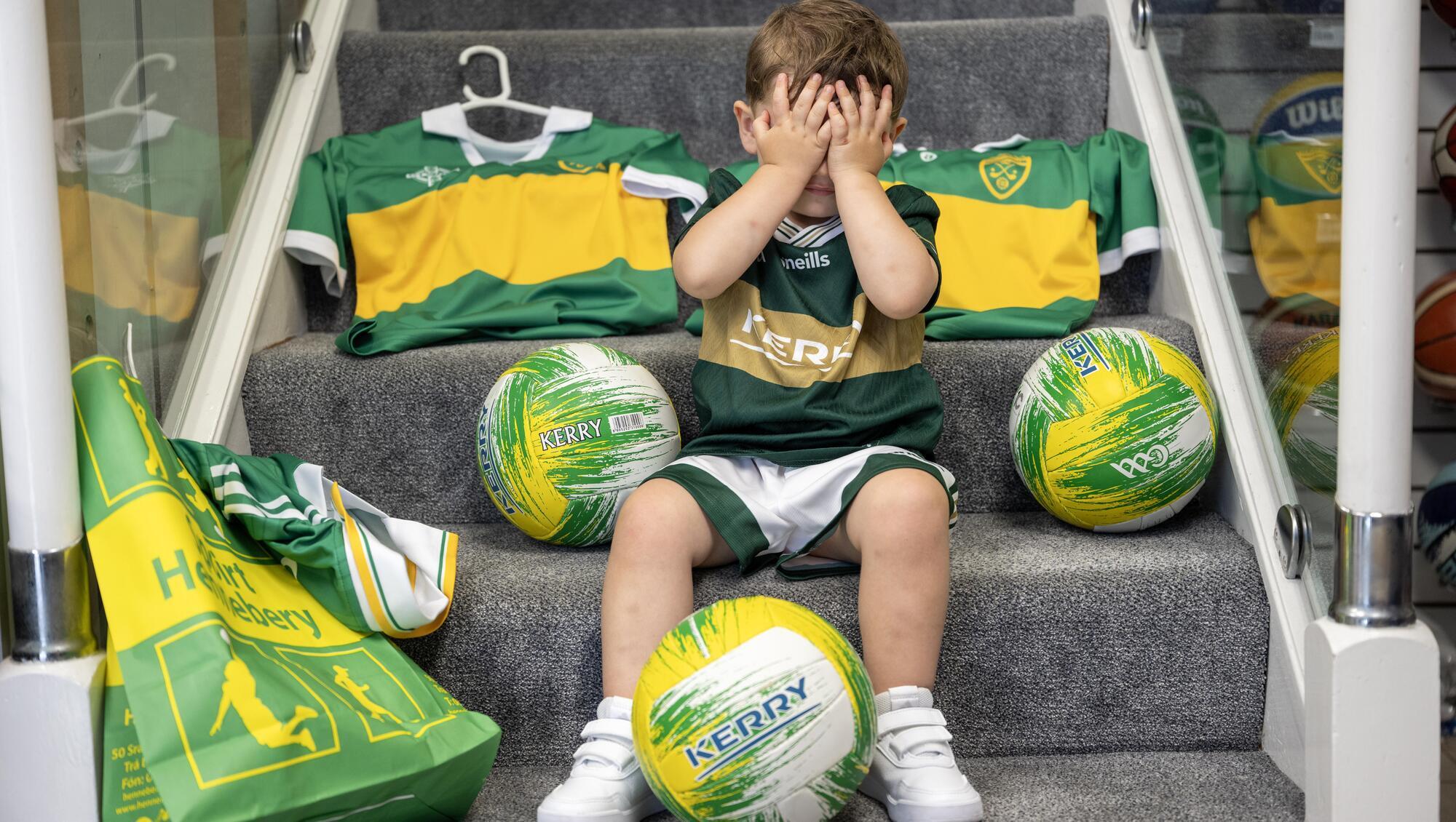WE'LL BE BACK: Two and a half year old Rían Horhan from Tralee comes to terms with Kerry's All-Ireland final defeat at the team's homecoming in Tralee. 
