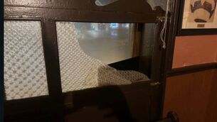 <p>Glass paneling in Cannon’s Bar in Castlebar was damaged on Monday</p>