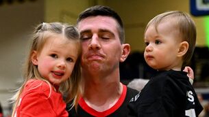 <p>SILENCE CAN BE GOLDEN: Ballincollig head coach Ciarán O'Sullivan celebrates with his children Emma and Dylan after their Superleague Cup final win over Garveys Tralee Warriors at the National Arena. Pic: Shauna Clinton/Sportsfile</p>