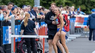 <p>A distraught Sharlene Mawdsley of Newport A.C. after pulling up injured in the Women’s 200m Final. Pic: Morgan Treacy/Inpho</p>