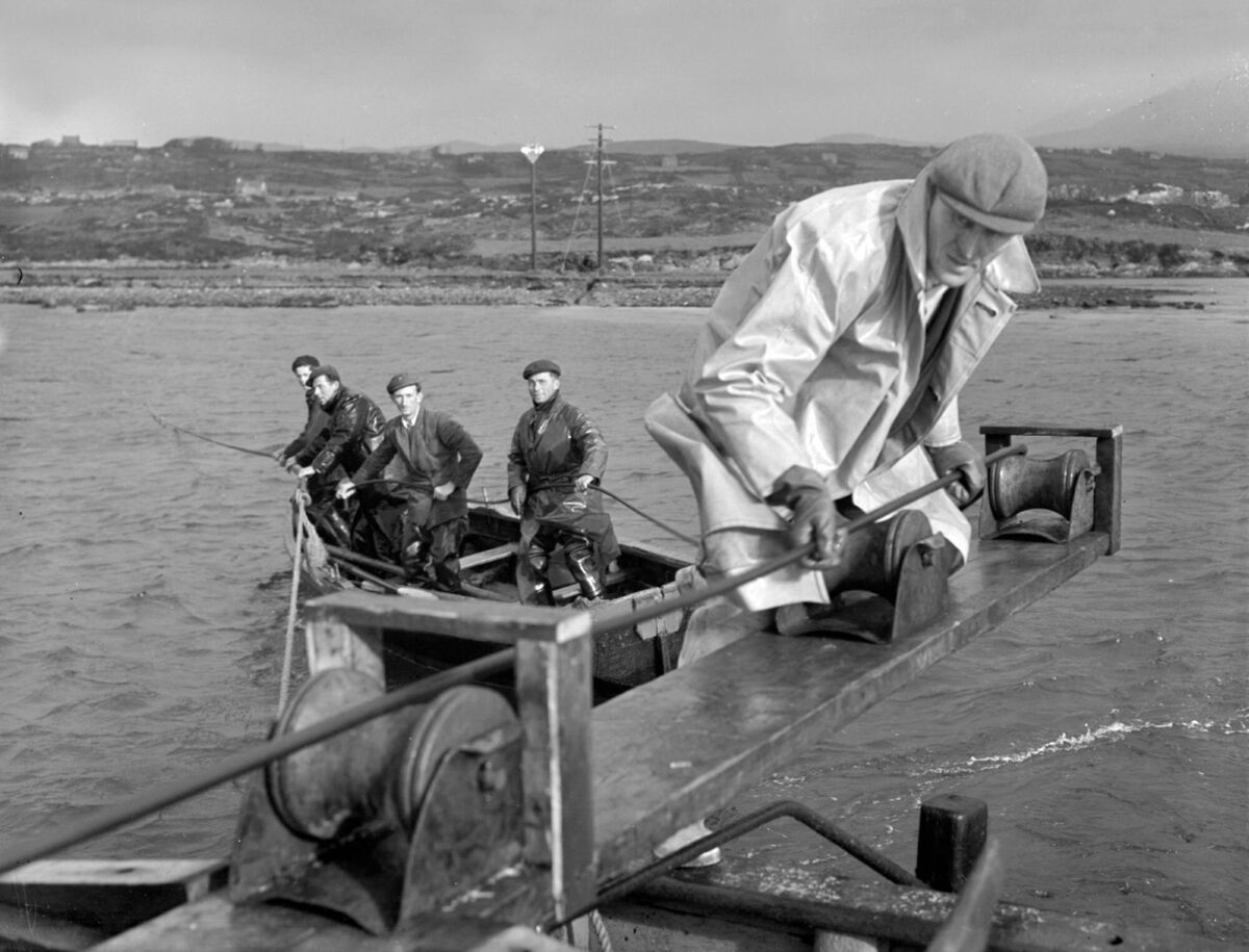 Electricity Supply Board (ESB) workers laying cable from Castletownbere to Bere Island in West Cork on March 12, 1958 as part of the Rural Electrification Scheme, which ran from the 1940s to the 1970s. Picture: Irish Examiner Archive Electricity Supply Board (ESB) workers laying cable from Castletownbere to Bere Island in West Cork on March 12, 1958 as part of the Rural Electrification Scheme, which ran from the 1940s to the 1970s. Picture: Irish Examiner Archive