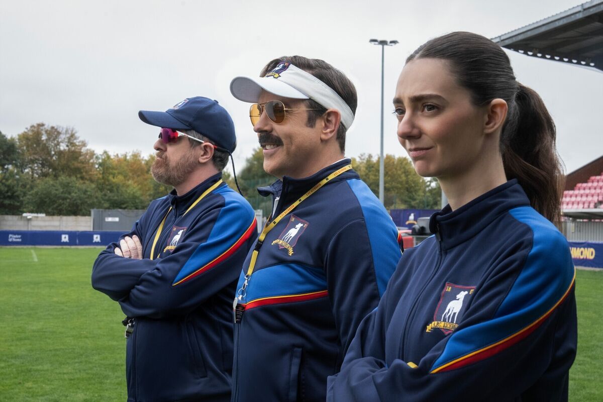 Brendan Hunt as Coach Beard, with Jason Sudeikis as Ted Lasso, joined by newcomer Tanya Reynolds in series 4 of the hit comedy. Picture: Apple TV+/Colin Hutton Brendan Hunt as Coach Beard, with Jason Sudeikis as Ted Lasso, joined by newcomer Tanya Reynolds in series 4 of the hit comedy. Picture: Apple TV+/Colin Hutton