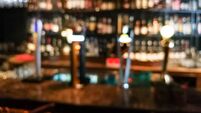 Blur vision perspective view of a drunk person in pub