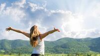 One young woman Feeling free outdoor in the wheat field