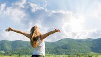 One young woman Feeling free outdoor in the wheat field