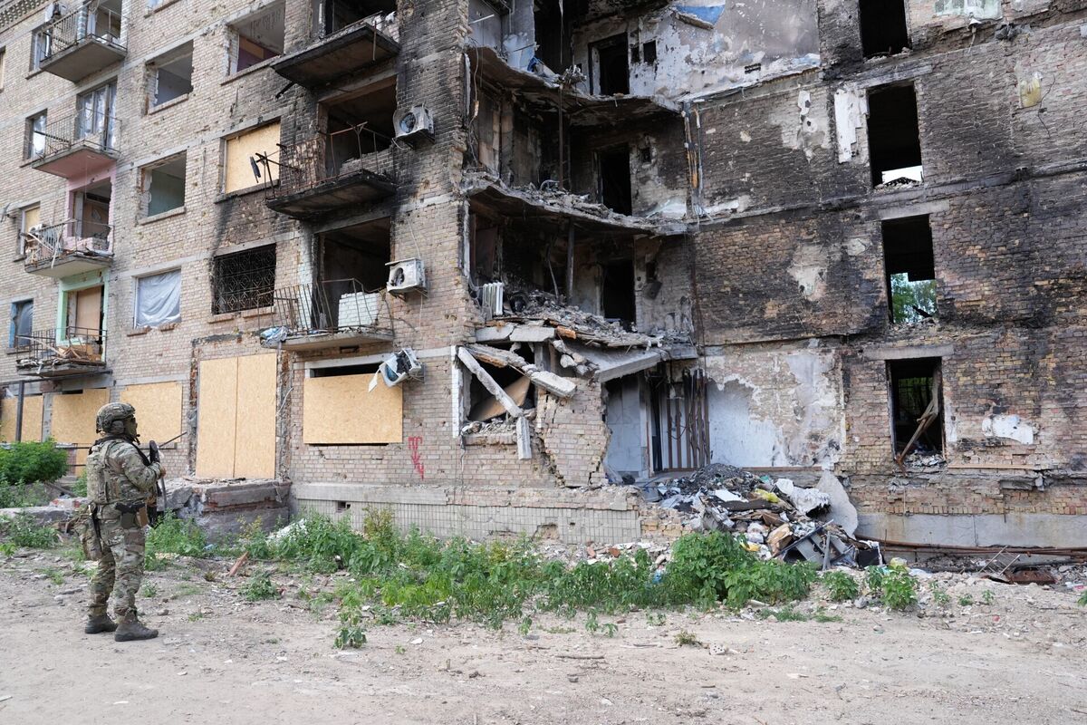 A Ukrainian soldier, at the bomb damaged Lukianivska district of Kyiv, Ukraine, looks up at the damaged buildings. Picture: Niall Carson/PA Wire A Ukrainian soldier, at the bomb damaged Lukianivska district of Kyiv, Ukraine, looks up at the damaged buildings. Picture: Niall Carson/PA Wire