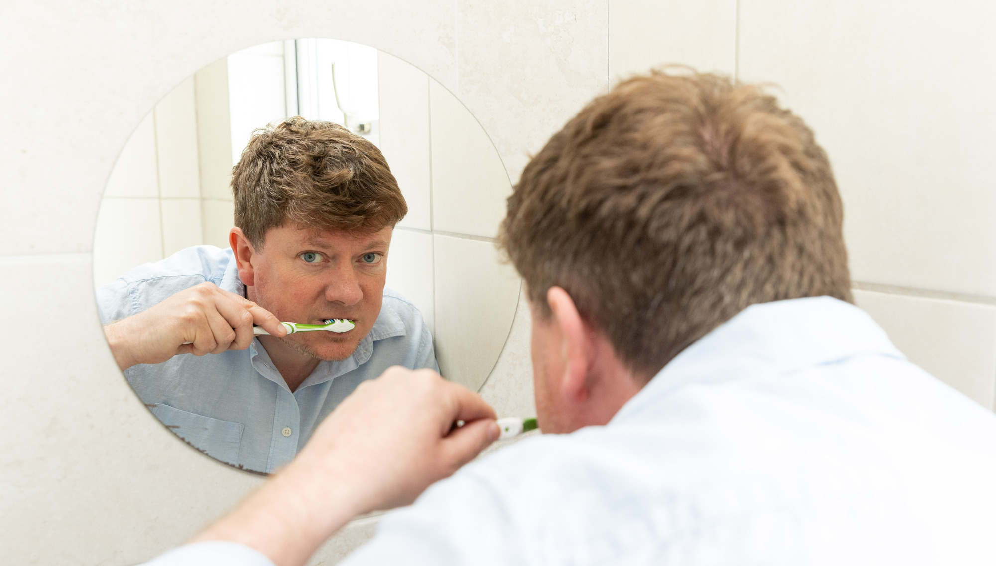 Jonathan deBurca Butler brushing his teeth with his non-dominant hand. Pictures: Gareth Chaney