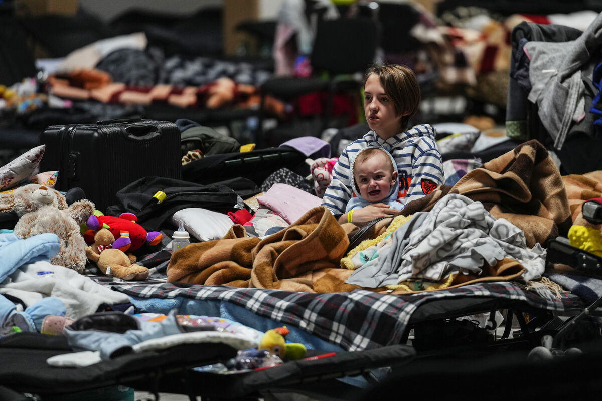 Ukrainian children sit in a refugee center in Nadarzyn, near Warsaw in 2022 following the Russian invasion of Ukraine. . (AP Photo/Petr David Josek)