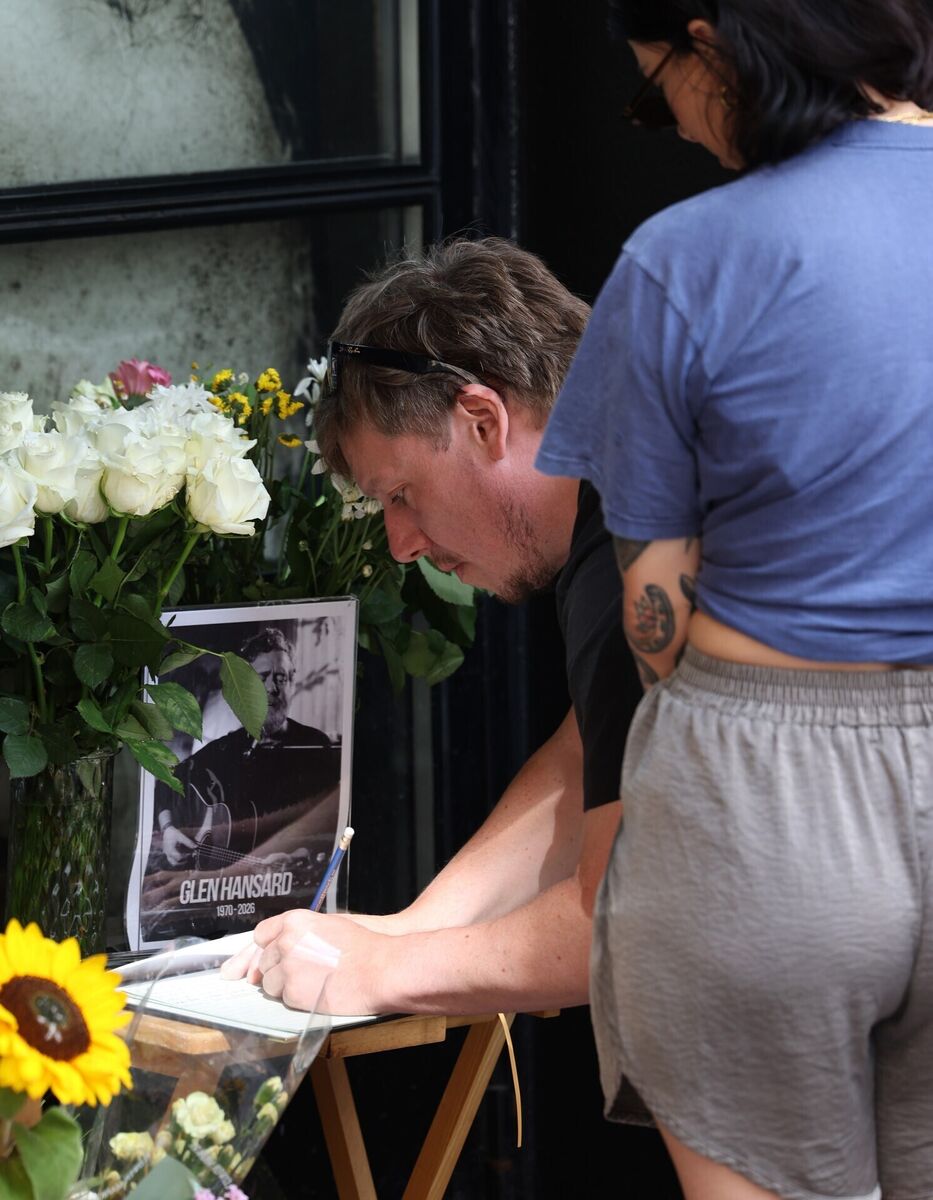 People sign a book of condolence for Glen Hansard in Temple Bar. Picture: Damien Eagers/PA People sign a book of condolence for Glen Hansard in Temple Bar. Picture: Damien Eagers/PA