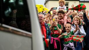 <p>READY TO BURST: Supporters cheer the Mayo team bus on the way to the homecoming celebrations at MacHale Park in Castlebar. Picture: Piaras Ó Mídheach/Sportsfile</p>