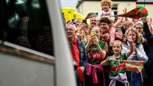 <p>READY TO BURST: Supporters cheer the Mayo team bus on the way to the homecoming celebrations at MacHale Park in Castlebar. Picture: Piaras Ó Mídheach/Sportsfile</p>