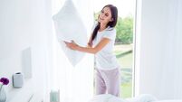 Daily home work routine. Charming beautiful nice stylish brunette girl doing everyday house work, householding, changing fresh c