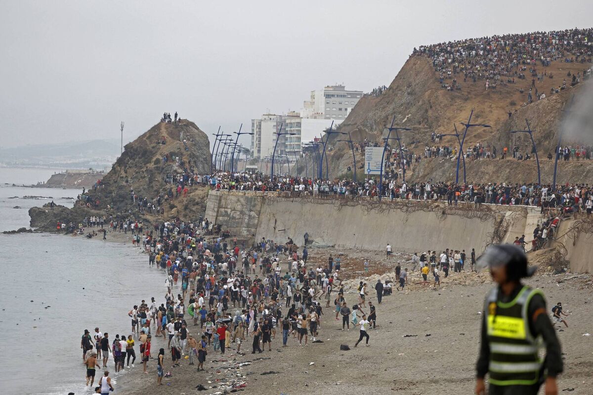 People gather along the fence at the site of clashes near Fnideq, on the Morocco-Spain border, on July 31, 2026. Picture: Abdel Majid BZIOUAT / AFP via Getty Images People gather along the fence at the site of clashes near Fnideq, on the Morocco-Spain border, on July 31, 2026. Picture: Abdel Majid BZIOUAT / AFP via Getty Images