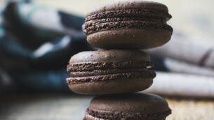 <p> Fresh baked chocolate macarons on wooden texture</p> <p> Fresh baked chocolate macarons on wooden texture</p>
