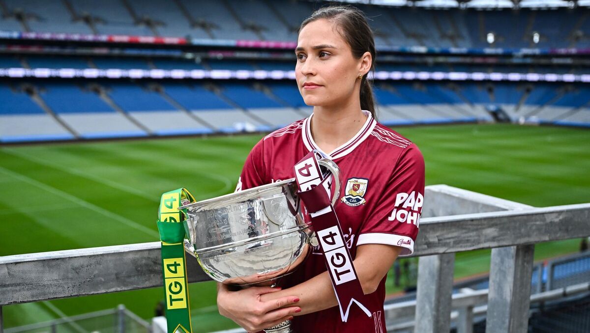 Galway footballer Kate Geraghty poses for a portrait with The Brendan Martin Cup. Pic: Piaras Ó Mídheach/Sportsfile