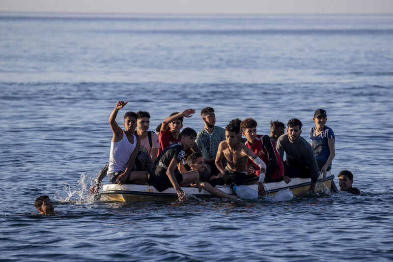 Migrants arrive at the Spanish enclave of Ceuta in May 2021. Picture: AP Photo/Bernat Armangue