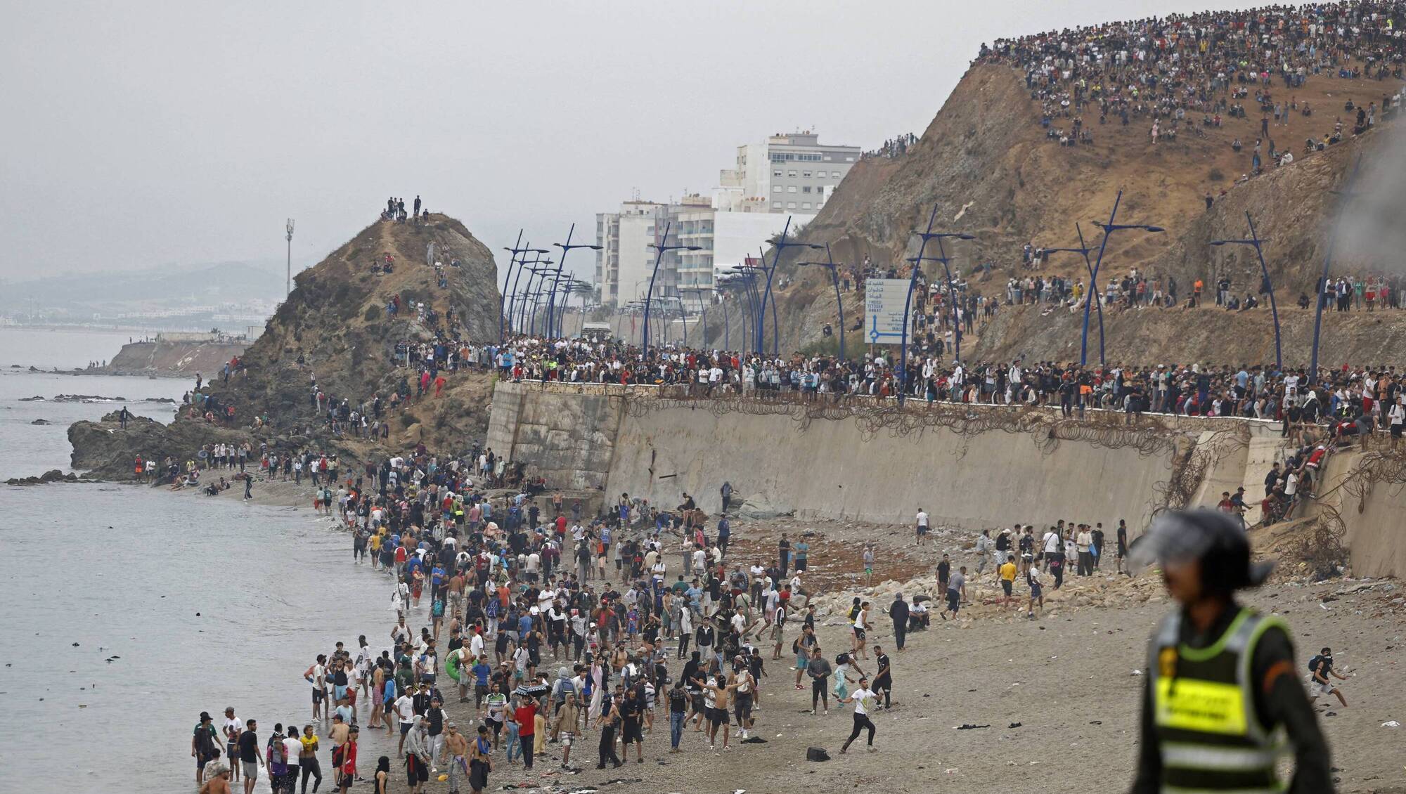 At least 57 people die as up to 60,000 cross to Spanish enclave of Ceuta from Morocco
