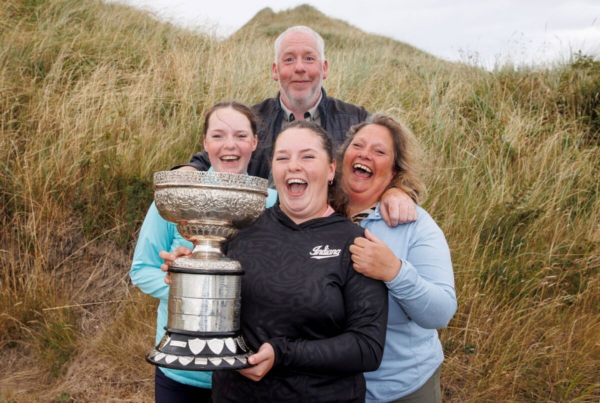 Winner of the 2026 AIG Irish Women's Amateur Close Championship Katie Poots with her sister Erin, her father John and mother Alison at Enniscrone. Picture: Tom Maher/Inpho Winner of the 2026 AIG Irish Women's Amateur Close Championship Katie Poots with her sister Erin, her father John and mother Alison at Enniscrone. Picture: Tom Maher/Inpho