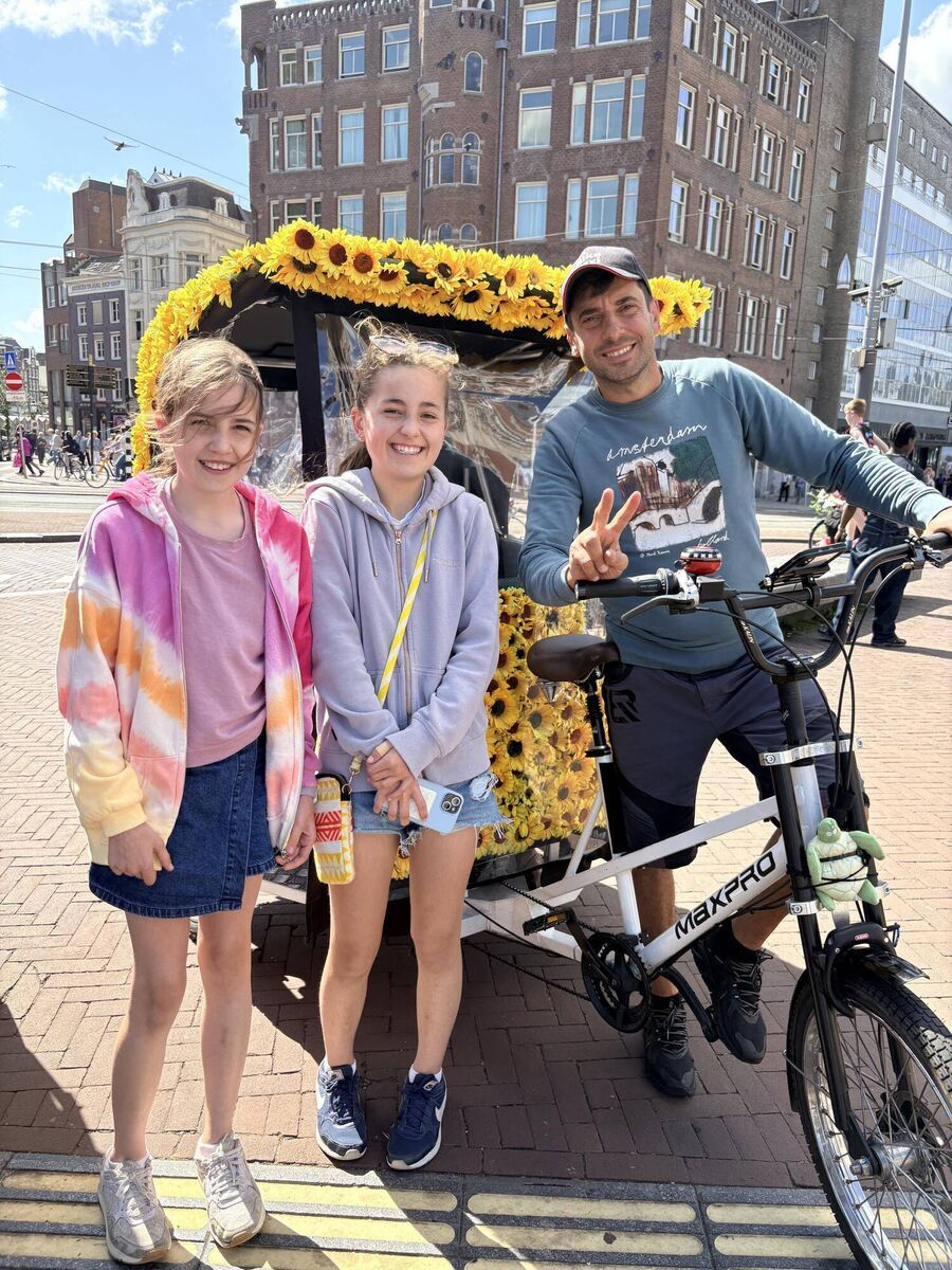 Vickie's daughters enjoy a sunflower-studded rickshaw tour of Amsterdam with Bobby from I Am Bike Taxi Rides & Tours. Vickie's daughters enjoy a sunflower-studded rickshaw tour of Amsterdam with Bobby from I Am Bike Taxi Rides & Tours.