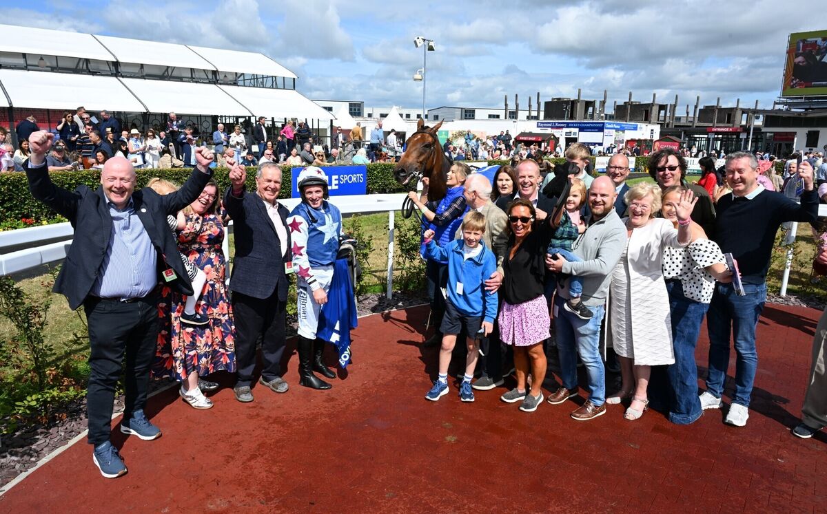 Jockey Sean Flanagan celebrates with winning connections, including trainer Harry Rogers and the Nap Racing Syndicate, alongside Grann's Boy after their win Pic: PA Wire. Jockey Sean Flanagan celebrates with winning connections, including trainer Harry Rogers and the Nap Racing Syndicate, alongside Grann's Boy after their win Pic: PA Wire.