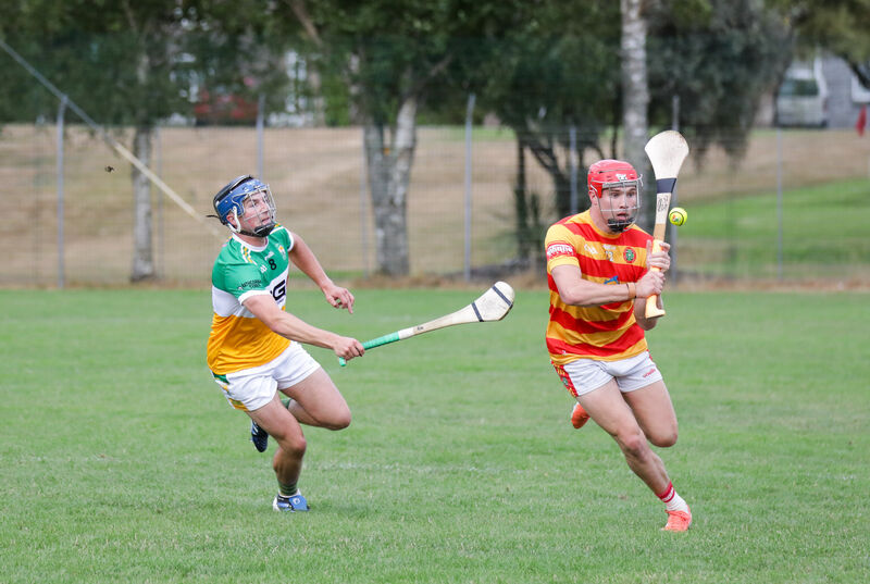 Newcestown's Richard O'Sullivan and Bride Rovers Ronan O'Connell chase the dropping ball. Pic: David Creedon