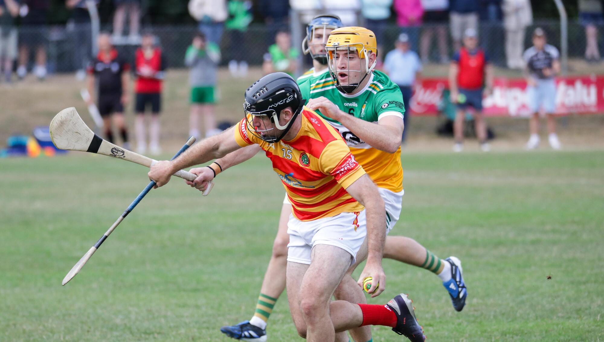 Newcestown's Colm Dinneen tries to get away from Bride Rovers Cillian Tobin. Pic: David Creedon