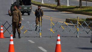 <p>Fida Hussain, a regional police official, said the victims included five police officers and eight civilians. The 14th person was believed to be the suicide bomber, he told Reuters. Picture: AP Photo/Anjum Naveed.</p> <p>Fida Hussain, a regional police official, said the victims included five police officers and eight civilians. The 14th person was believed to be the suicide bomber, he told Reuters. Picture: AP Photo/Anjum Naveed.</p>